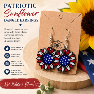 Patriotic sunflower dangle earrings featuring red, white, and blue petals with star-spangled centers displayed on a wooden riser with sunflower and American flag accents.